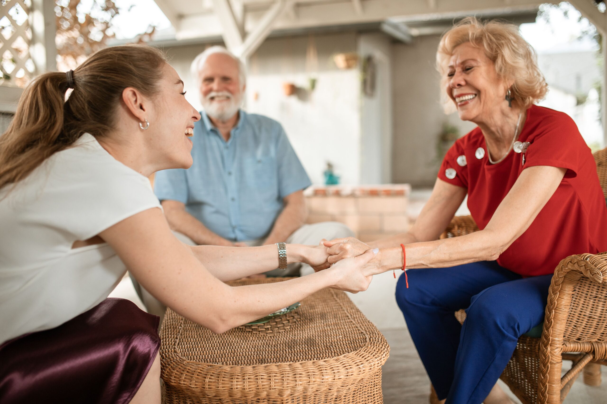 Nurse holding hands with woman