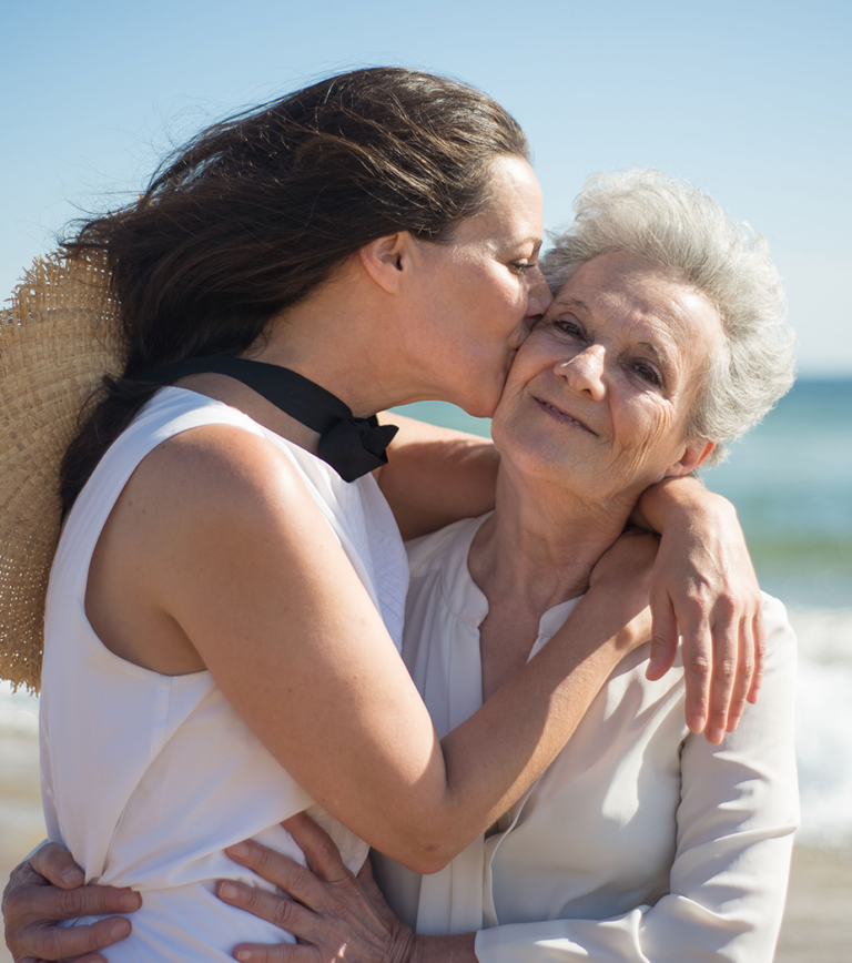 daughter kisses mom on cheek